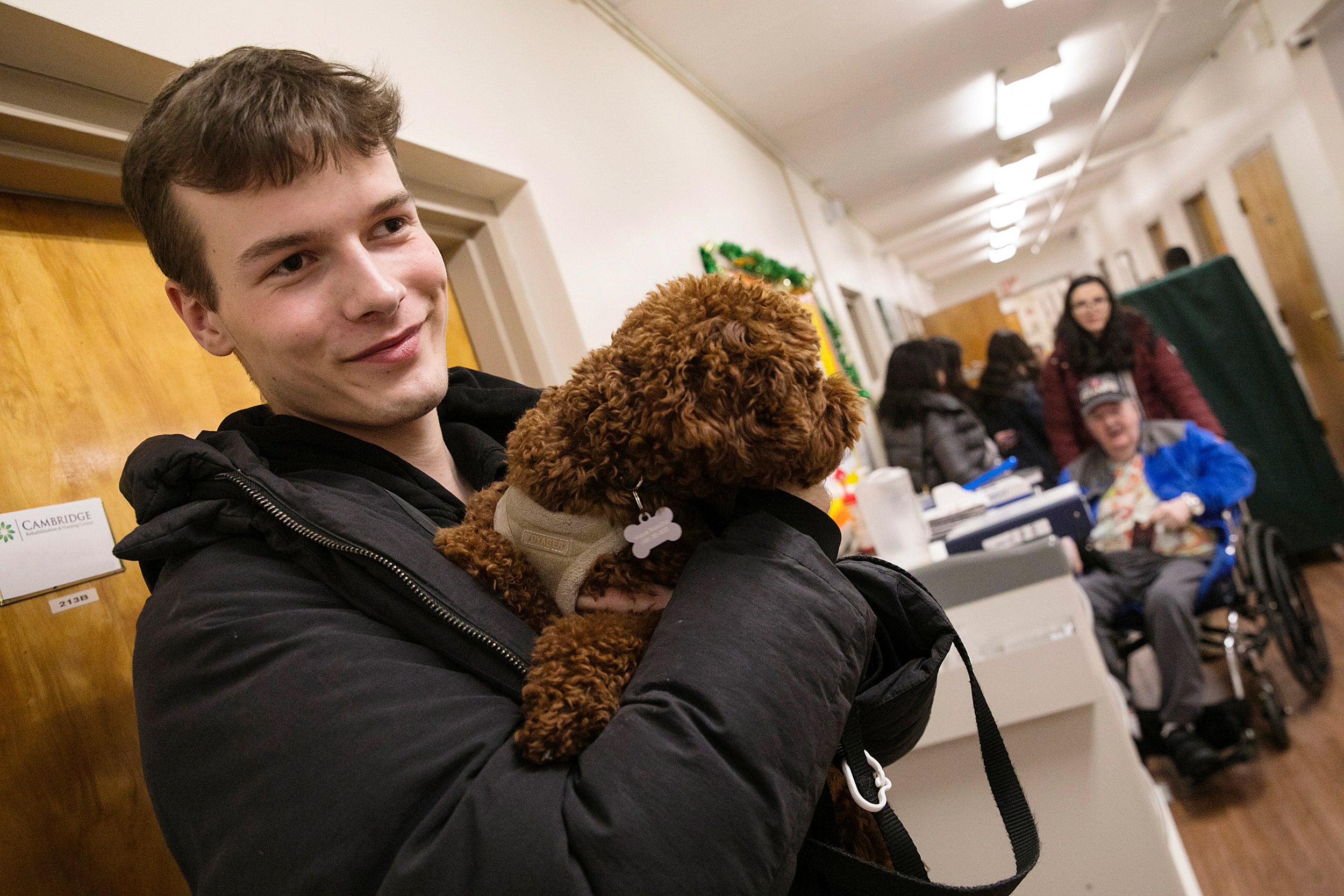 Man holding small dog